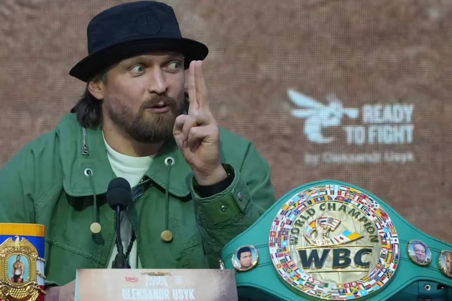 Oleksandr Usyk at a press conference with the WBC belt